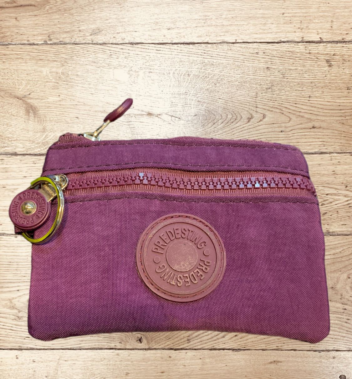 Monedero impermeable morado