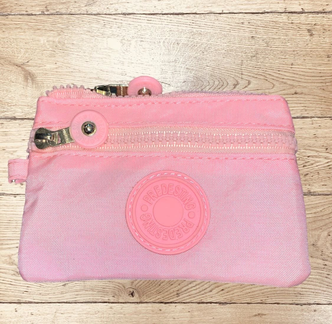 Monedero impermeable rosado